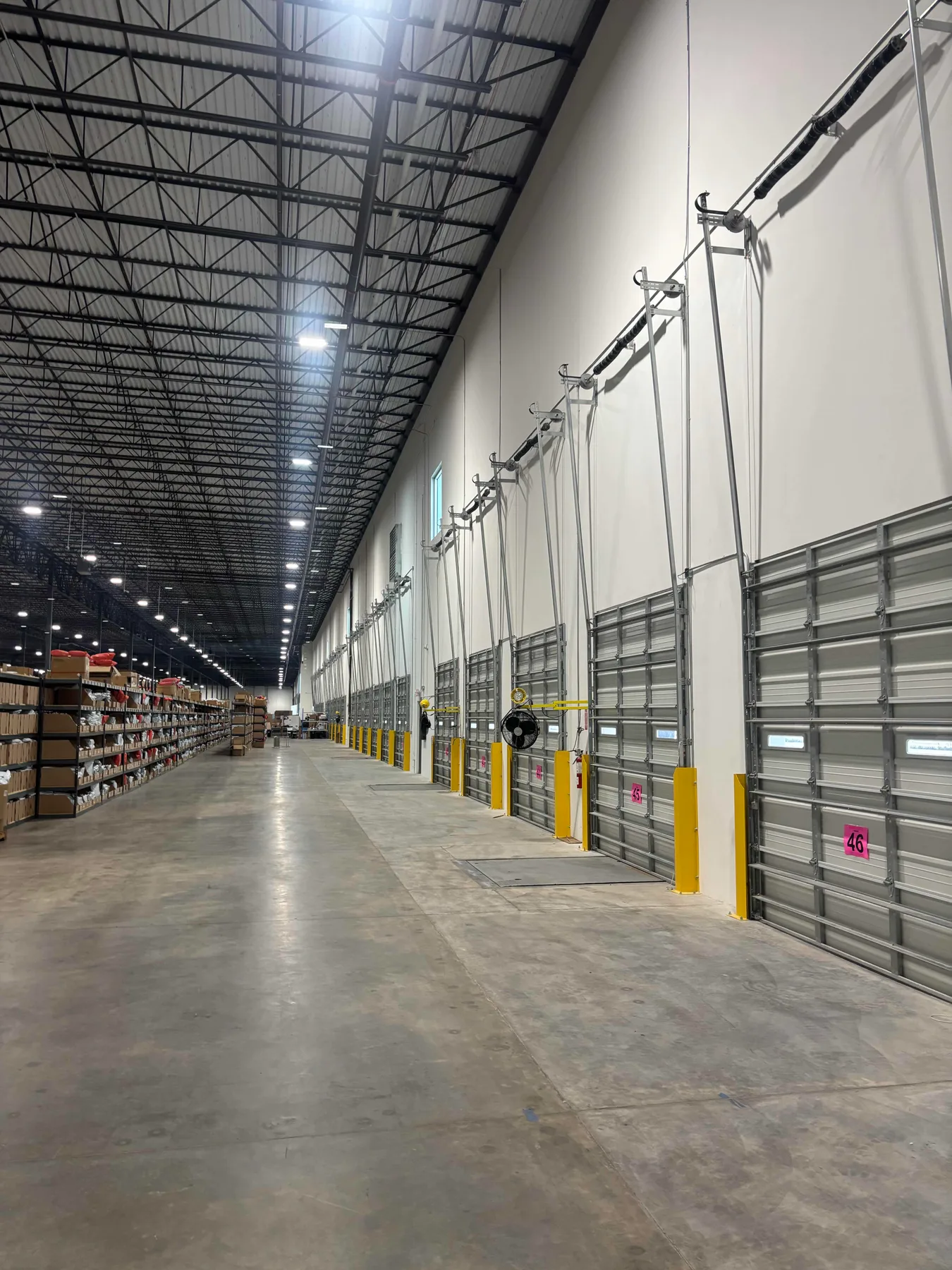 Lighting and electrical infrastructure along warehouse loading bays